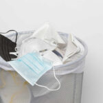Air Pollution’s Hidden War on Bones A trash bin filled with various discarded face masks