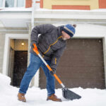Winter Mold: The Silent House Killer Senior man shoveling snow in front of a house