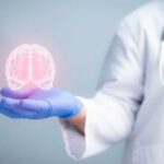 Global Study Reveals Surprising Mental Health Hack A medical professional holding a glowing digital brain illustration in their hand