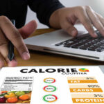 Sweet Breakfasts That Balance Blood Sugar Person using a calorie counter app on a tablet while working on a laptop