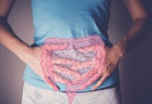 Extreme Heat’s Secret Attack on Your Gut Person holding their stomach with a graphic of intestines overlayed