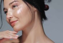 Close-up portrait of a woman with glowing skin and a gentle smile