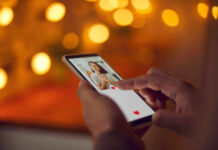 Person using a smartphone to interact with a dating app