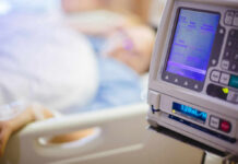 Hospitals Hand AI the Operation Room IV pump displaying medication flow rate in a hospital room