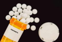 Silent Shield Against Fentanyl Emerges Prescription bottle of fentanyl with white pills scattered around