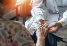 Semaglutide’s Bone Paradox Stuns Doctors A doctor holding the hand of an elderly patient during a consultation