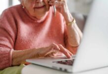 Hidden Alzheimer’s—Why Some Brains Stay Sharp Elderly woman on a phone call while using a laptop