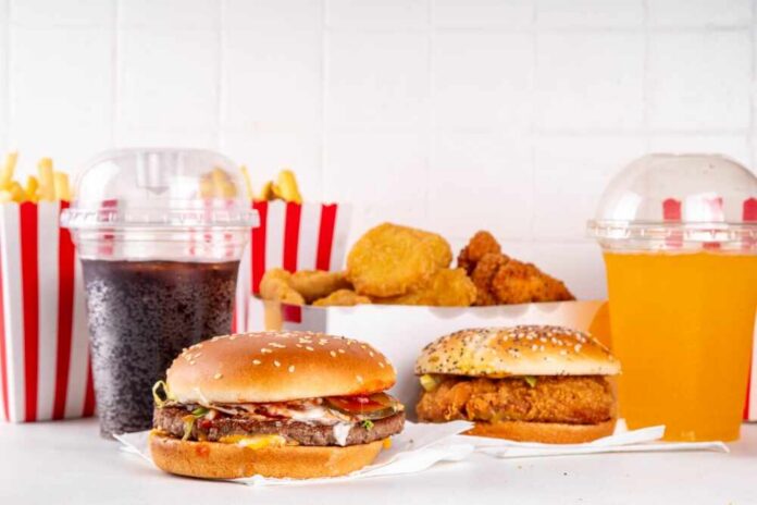 Fast,Food,Delivery,Menu,Background,With,Various,Burgers,,Cheeseburger,,Nuggets, A variety of fast food items including burgers, fries, and drinks