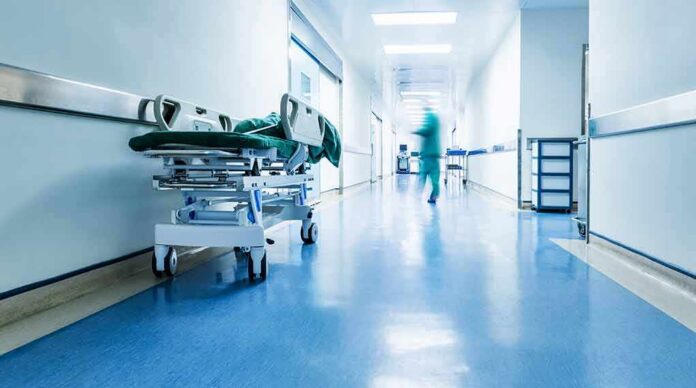 Hospital corridor with empty gurney