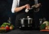 Dinner Staple that Blocks the Spread of Cancer Cook adding sliced mushrooms to a pot