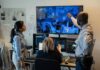 6G: Heartbeat Tracked Through Walls Security team monitors multiple surveillance screens in control room