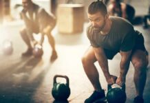 Want to Age Well? – Join The 2-3-4 Club Man lifting a kettlebell in a gym