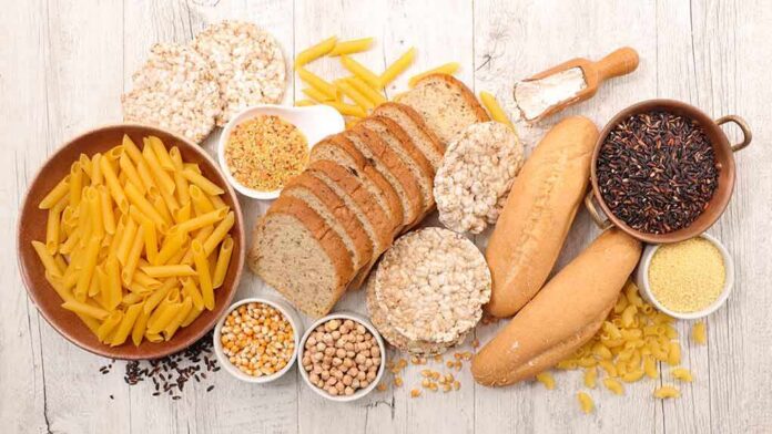 Assorted grains and breads on a wooden table