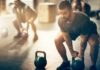 Muscle Growth: Why Training Beats Shakes Man lifting a kettlebell in a gym