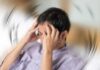 Stroke Rehab Myth DEBUNKED — Rest Isn’t Recovery Person holding head with spinning blur effect