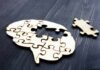Daily Micro-Habits That Improve Brain Health Wooden brain-shaped jigsaw with a missing piece