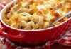 Late-Night Protein Shocks Diet Dogma Baked pasta casserole with golden melted cheese in a red dish