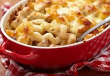 Late-Night Protein Shocks Diet Dogma Baked pasta casserole with golden melted cheese in a red dish
