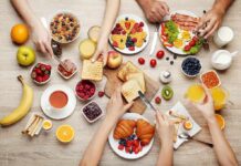 Heart Risk Plunges With This Breakfast Swap Breakfast table with assorted foods and hands serving
