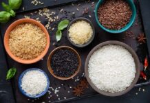 Easy cooking methods that flush arsenic out of rice Assorted rice varieties in bowls on a dark tray