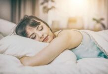 Woman sleeping on a bed