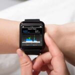 smartwatch displaying heart rate on a person's wrist