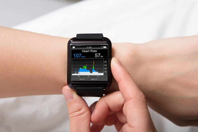 shutterstock_686338366 smartwatch displaying heart rate on a person's wrist