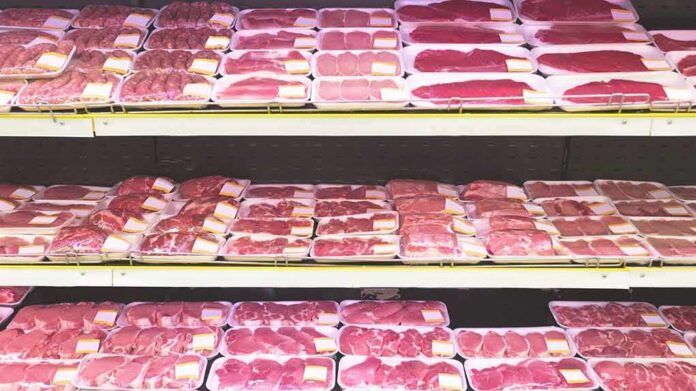 shutterstock_1162806103 Packaged raw meat displayed on supermarket shelves