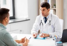 Low Levels Of This Mineral Are Linked To Uncontrolled Blood Sugar Doctor explaining glucose meters to a patient