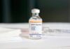 MMR vaccine vial on a white surface
