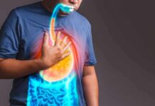 Person clutching chest with illustrated reflux and stomach overlay